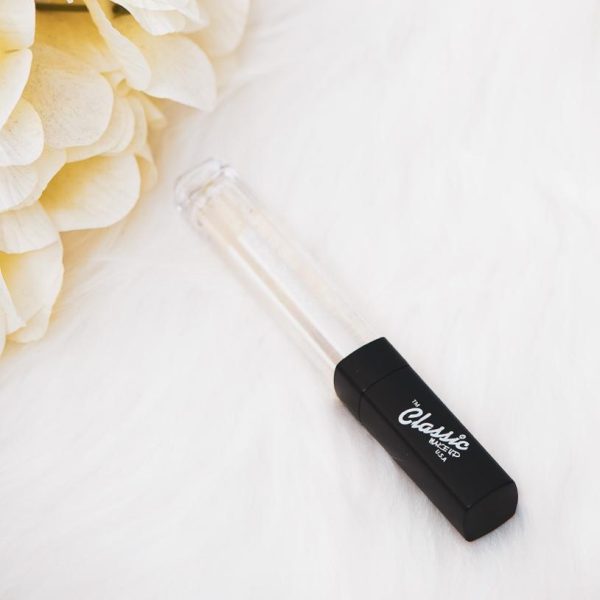 Classic Lip Gloss - Shiny lip makeup product in a clear tube with a wand applicator.